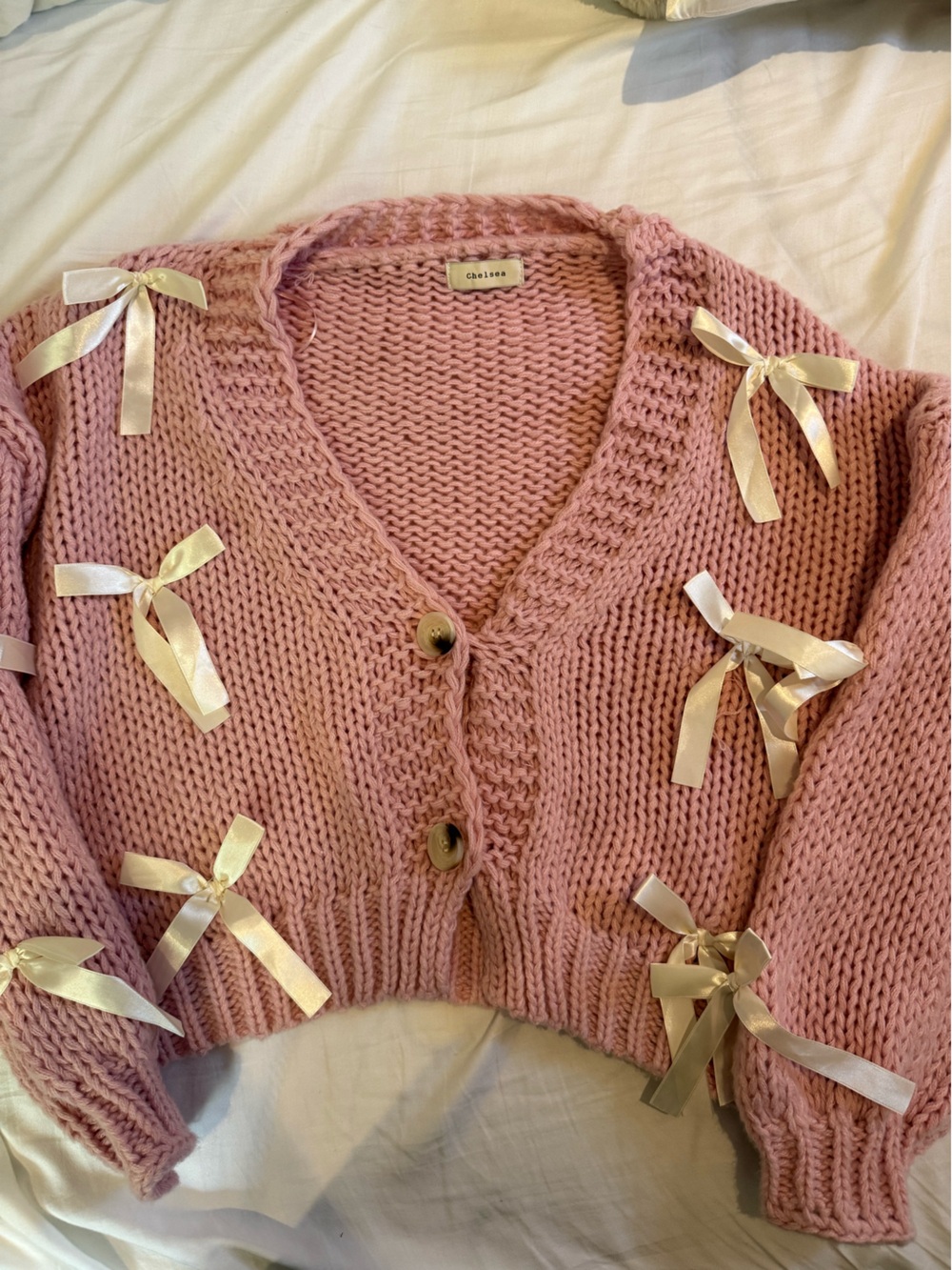Pink Ribbon-Accent Chunky Knit Women's Sweater with White Bows.